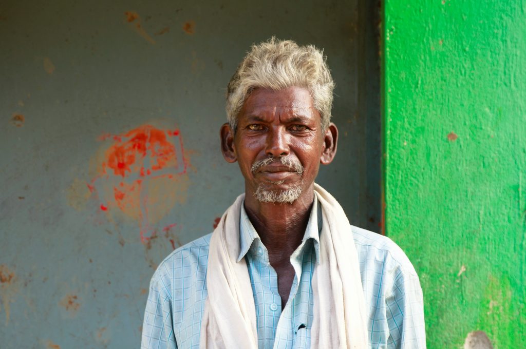 free services for seniors in india. old man looking at camera